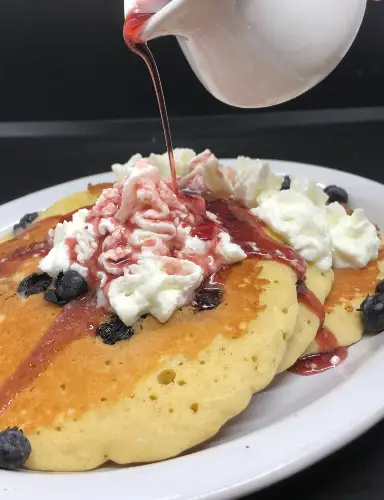 Blueberry pancake with blueberry syrup and cool whip at Tamiami Tavern in Punta Gorda, FL